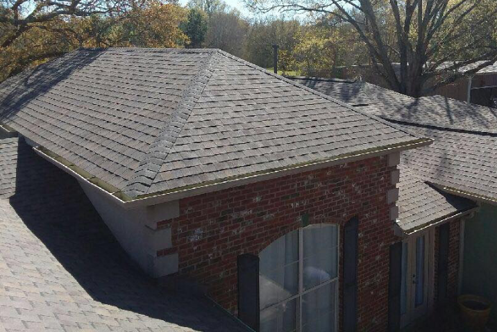 close-up of shingle roofing on a residential property, installed by Pride Roofing LLC