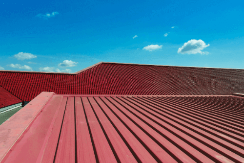 Close-up of metal roofing on a commercial building, installed by Pride Roofing LLC