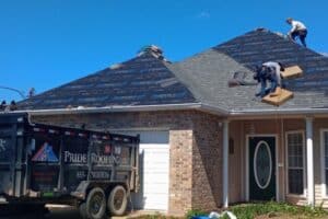 Roofing Contractor in Hammond, LA with Pride Roofing LLC. image of a worker at the top of the roof installing roofing on the client in Hammon LA by Pride Roofing LLC