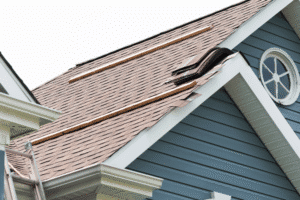 Atlas roofing shingles in Hammond, LA, at Pride Roofing LLC. Image of a residential asphalt shingle roof undergoing replacement, with old shingles removed and new roofing materials staged for installation to improve durability, weather protection, and curb appeal.